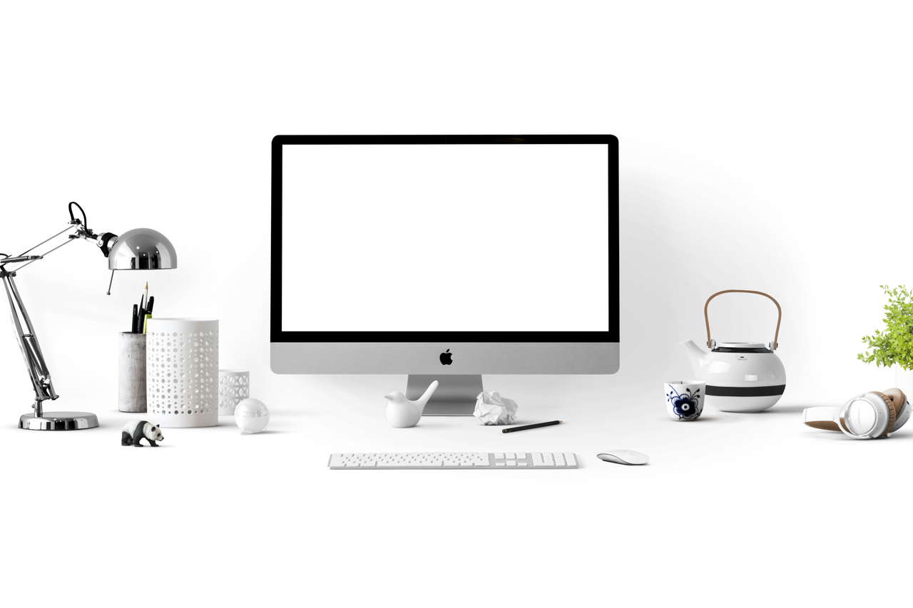 about-us Minimalist office desk with an iMac, lamp, and stationary, perfect for tech backgrounds.